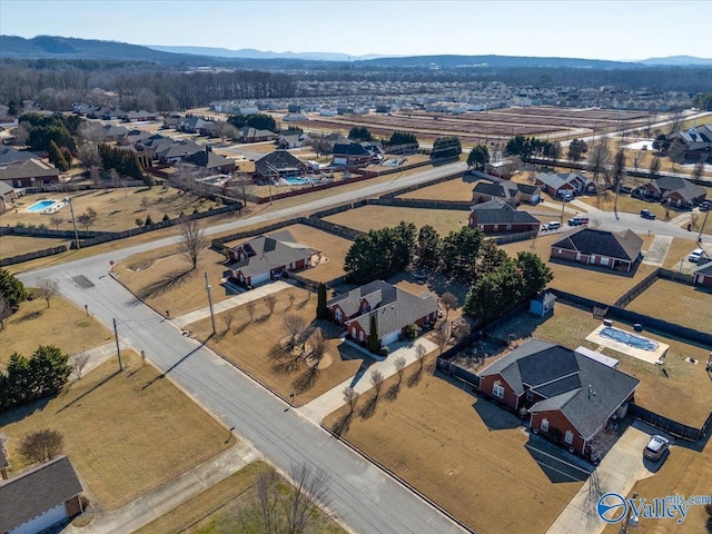 birds eye view of property with a mountain view