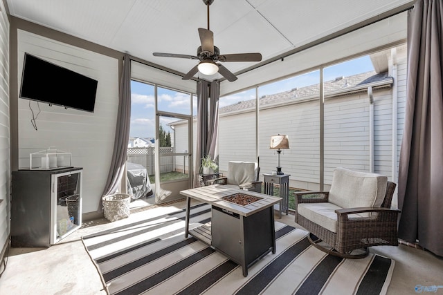 sunroom featuring ceiling fan