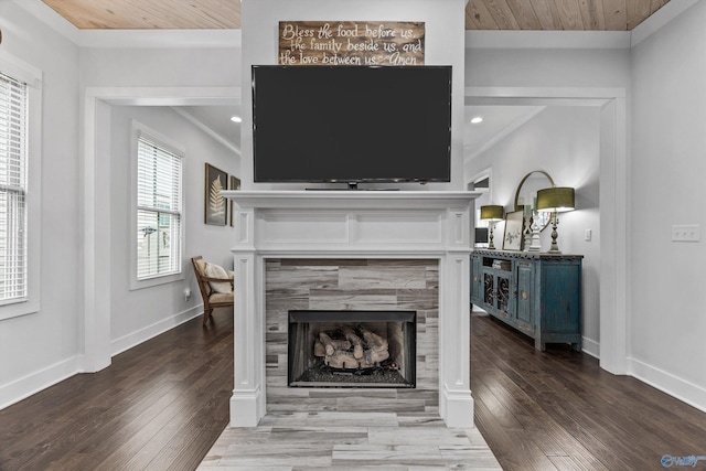 living room featuring hardwood / wood-style flooring, wood ceiling, and a tiled fireplace