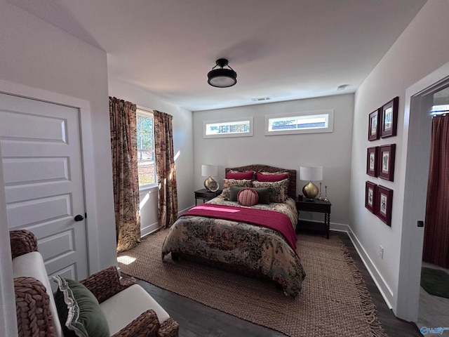 bedroom featuring dark hardwood / wood-style floors