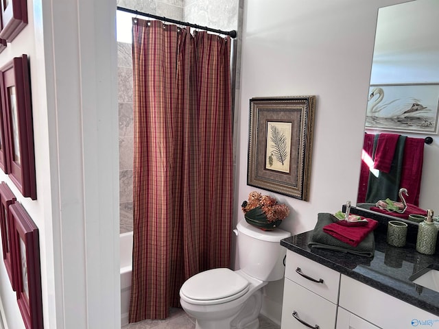 full bathroom with vanity, toilet, and shower / tub combo