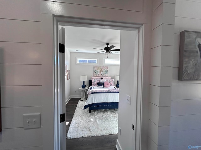 bedroom featuring ceiling fan and dark hardwood / wood-style floors