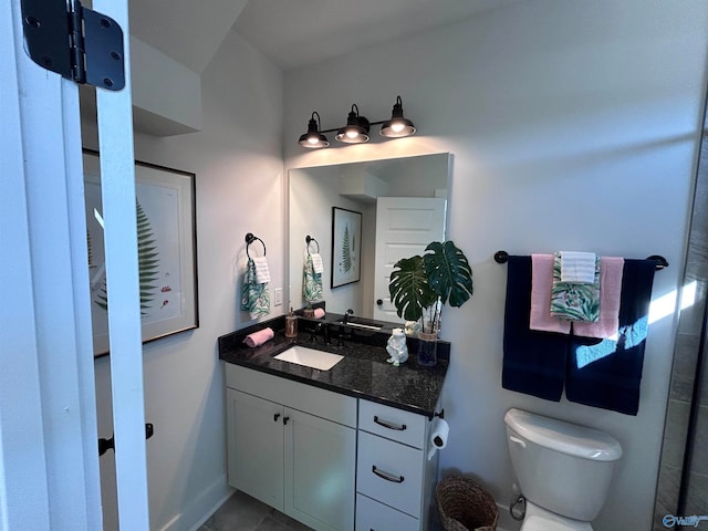 bathroom with tile patterned floors, vanity, and toilet