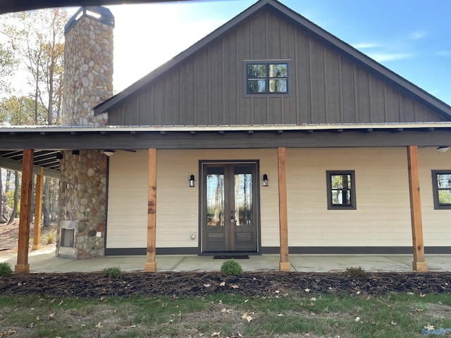 exterior space featuring a patio area, french doors, and a chimney