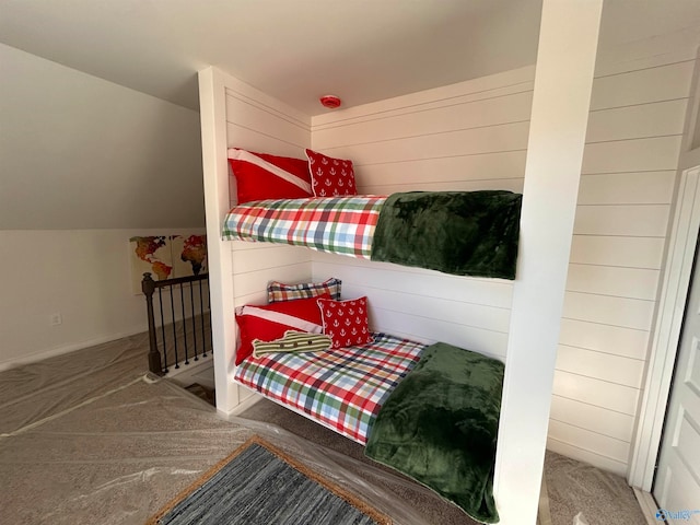 carpeted bedroom featuring lofted ceiling