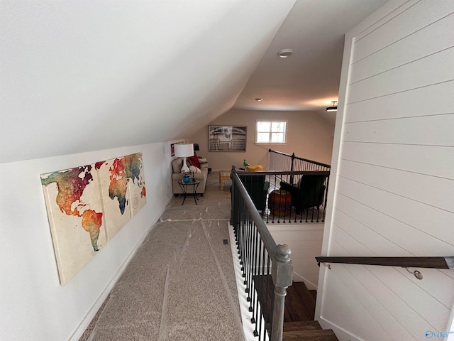 interior space featuring carpet flooring and lofted ceiling