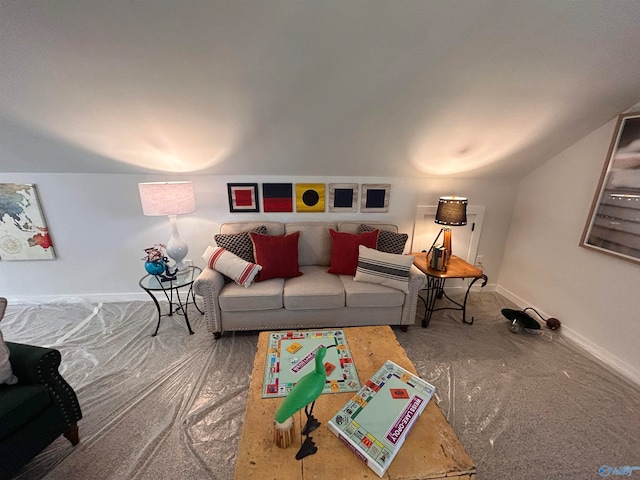 carpeted living room featuring vaulted ceiling