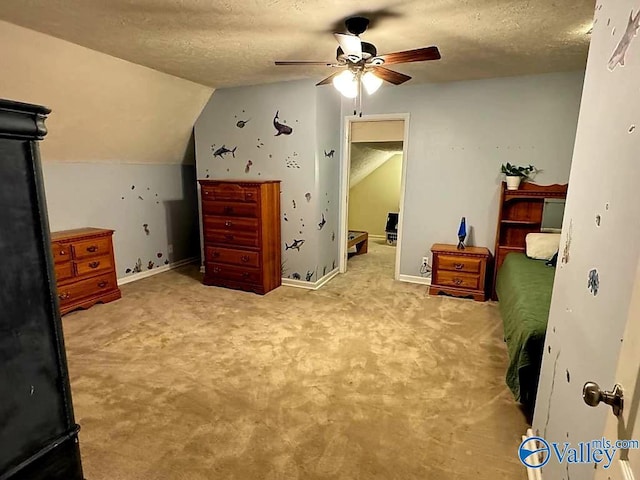 carpeted bedroom with lofted ceiling, ceiling fan, and a textured ceiling