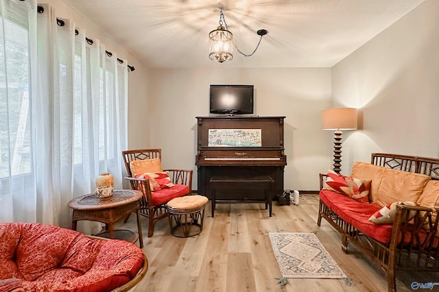 3103 Burningtree Mountain Rd, Decatur, AL 35603 - sitting room featuring healthy amount of natural light, wood finished floors, and a chandelier