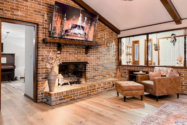 3103 Burningtree Mountain Rd, Decatur, AL 35603 - living area featuring wood finished floors, a fireplace, and brick wall
