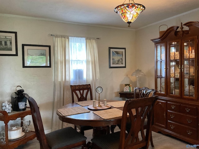 dining room with crown molding