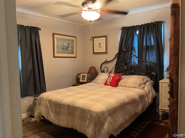 bedroom with ceiling fan, dark wood finished floors, and ornamental molding