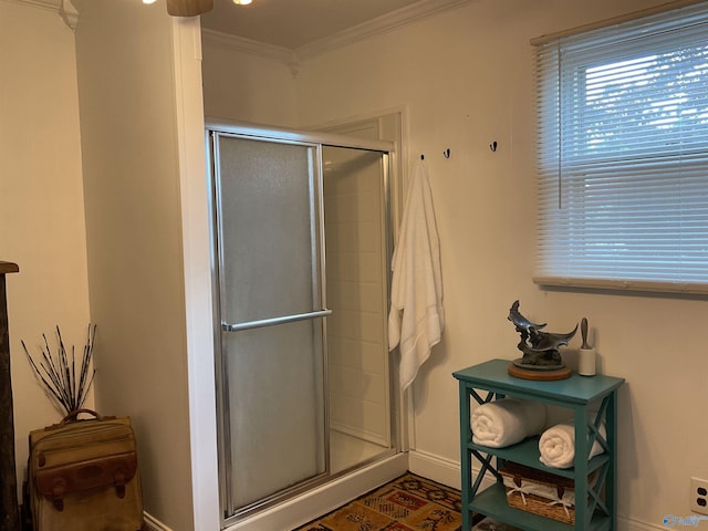 full bathroom with baseboards, a shower stall, and ornamental molding