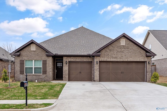 view of front of property featuring brick siding, a garage, and driveway