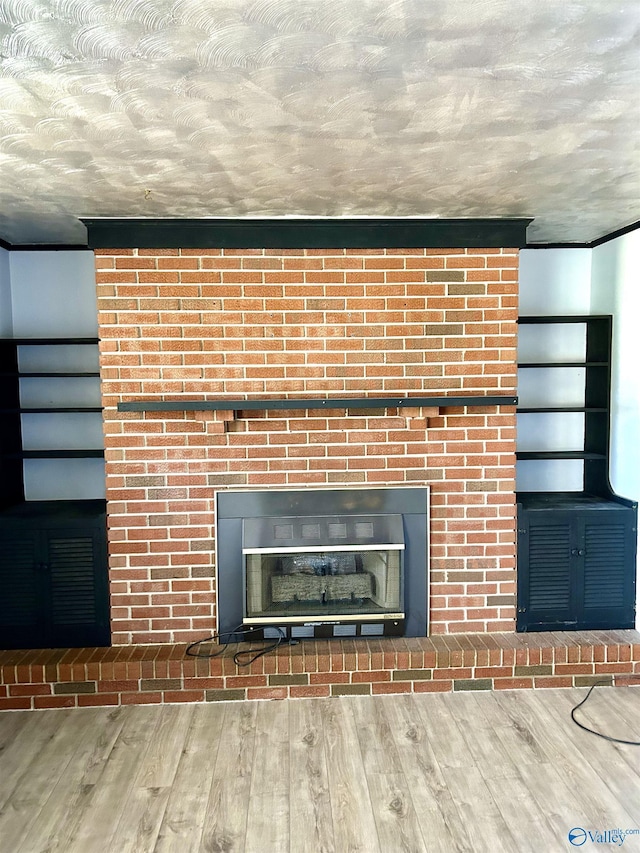 room details with wood-type flooring and a textured ceiling