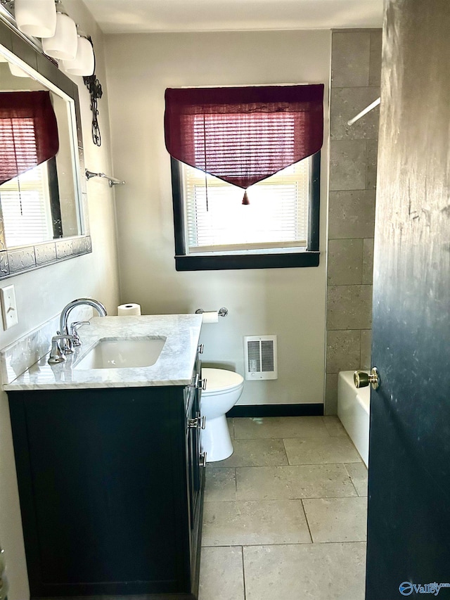 full bathroom featuring heating unit, vanity, shower / bathtub combination, and toilet