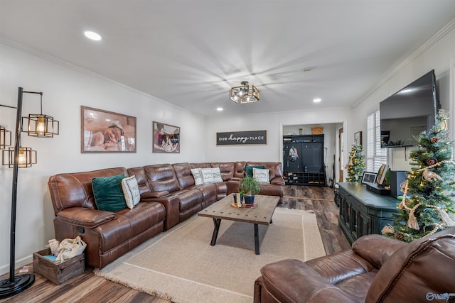 living room with hardwood / wood-style floors and ornamental molding