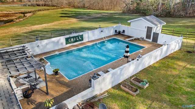 view of pool featuring a lawn and a diving board