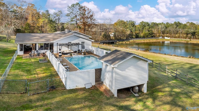 view of swimming pool featuring a yard, a pergola, a water view, and a patio