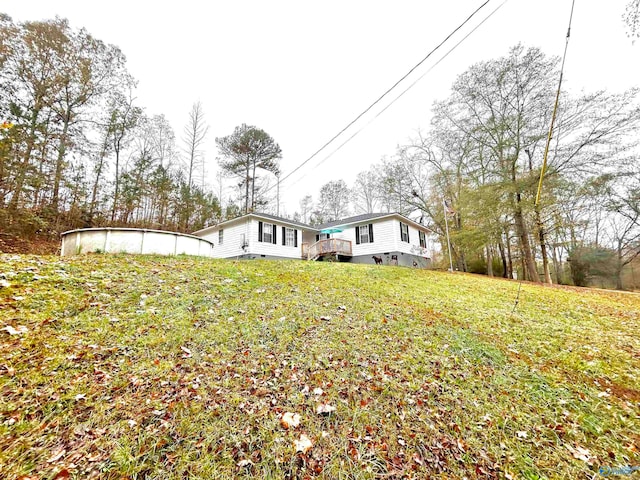 back of house featuring a yard