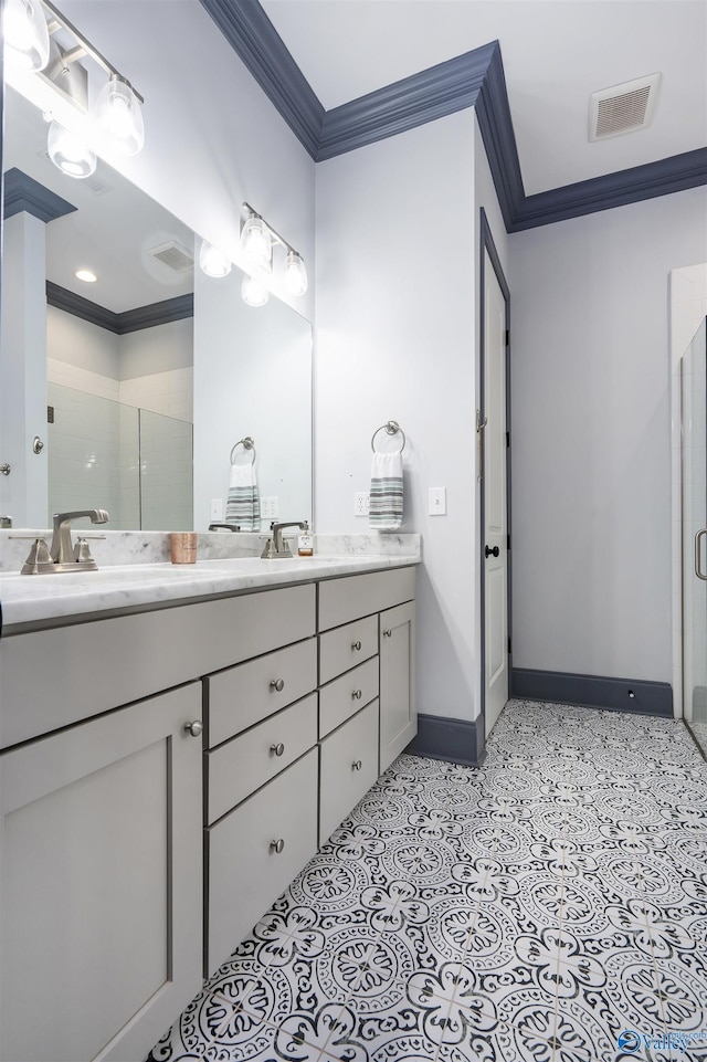 bathroom featuring vanity, ornamental molding, and walk in shower