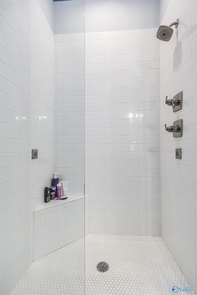 bathroom with tiled shower