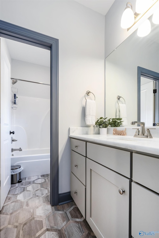 bathroom featuring vanity and bathing tub / shower combination