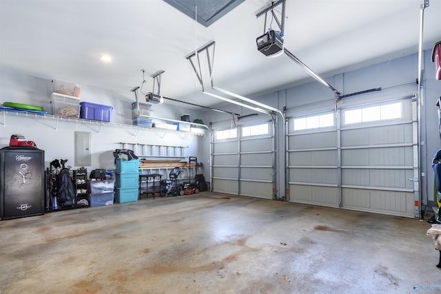 garage featuring a garage door opener and electric panel