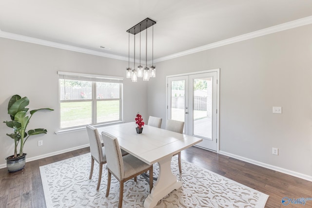 dining area featuring french doors, a wealth of natural light, and ornamental molding