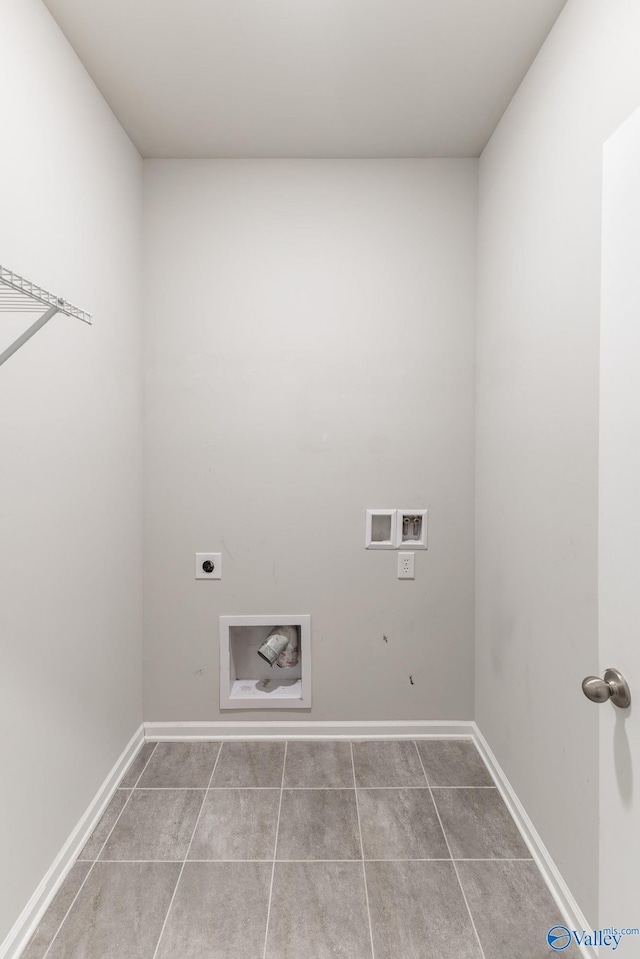 clothes washing area featuring tile patterned floors, washer hookup, baseboards, hookup for an electric dryer, and laundry area