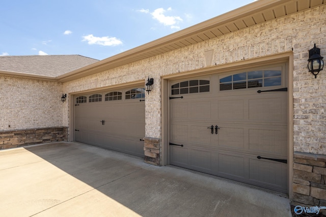 garage with concrete driveway