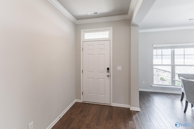 entryway featuring visible vents, baseboards, crown molding, and dark wood-type flooring