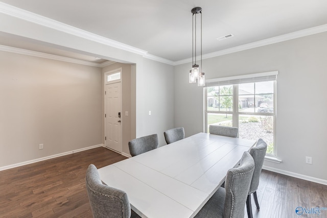 dining area with dark wood-type flooring, a healthy amount of sunlight, visible vents, and baseboards