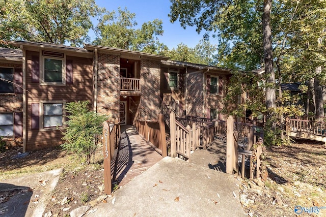 view of front of house with a balcony