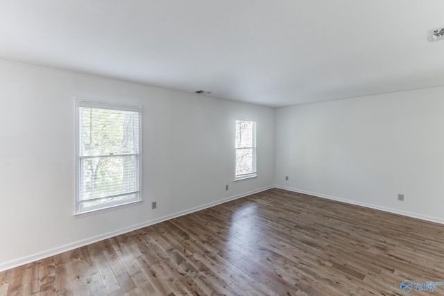 unfurnished room featuring wood-type flooring