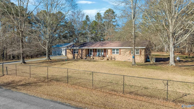 ranch-style home featuring a front yard