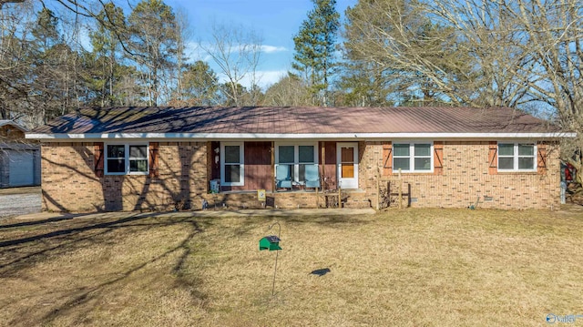 single story home with covered porch and a front lawn