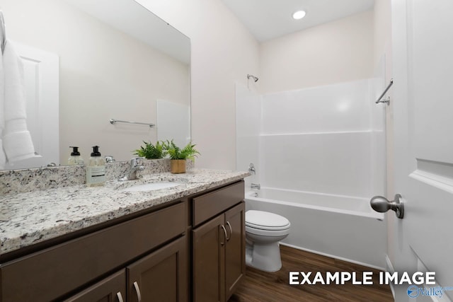 122 Burdine St, New Market, AL 35761 - bathroom featuring vanity, tub / shower combination, wood finished floors, and toilet