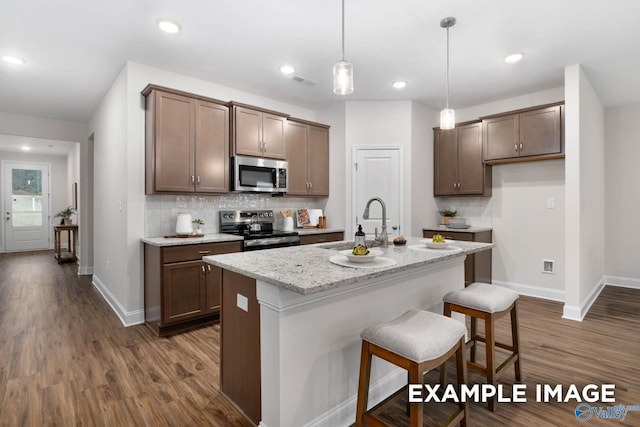 122 Burdine St, New Market, AL 35761 - kitchen with a sink, appliances with stainless steel finishes, baseboards, and dark wood-style flooring