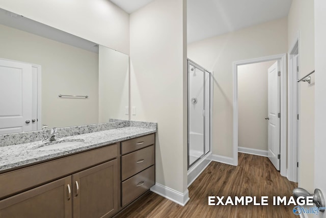 122 Burdine St, New Market, AL 35761 - full bathroom featuring baseboards, a shower stall, wood finished floors, and vanity