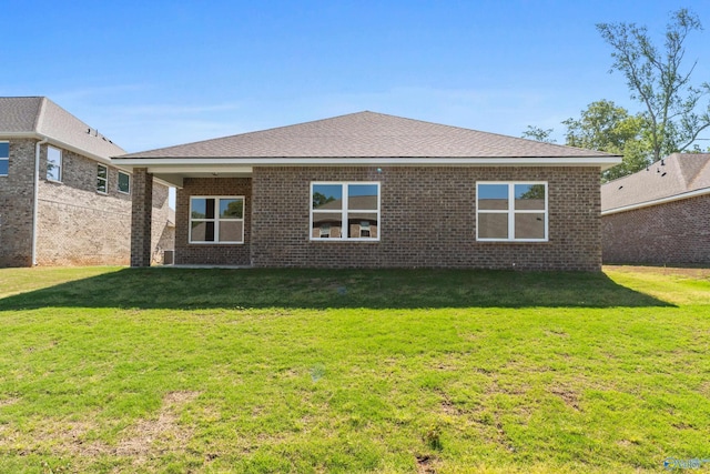 122 Burdine St, New Market, AL 35761 - rear view of property with a yard and brick siding