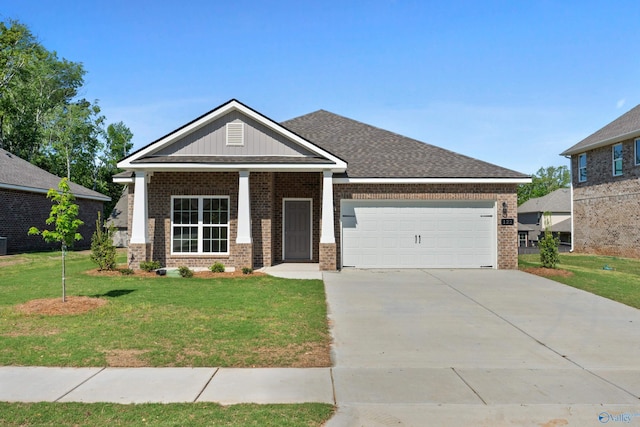 122 Burdine St, New Market, AL 35761 - view of front of house featuring brick siding, an attached garage, driveway, and a front yard