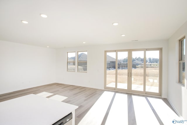 spare room with light hardwood / wood-style floors