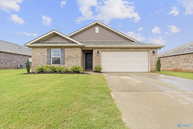 117 Hank Ct, Hazel Green, AL 35750 - view of front facade with a front yard, concrete driveway, a garage, and brick siding
