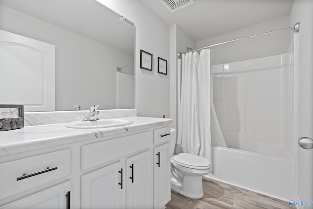 117 Hank Ct, Hazel Green, AL 35750 - full bath with vanity, wood finished floors, and shower / bath combo with shower curtain