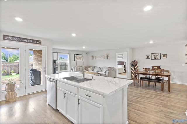 117 Hank Ct, Hazel Green, AL 35750 - kitchen with dishwasher, a center island with sink, light wood-style flooring, recessed lighting, and white cabinets