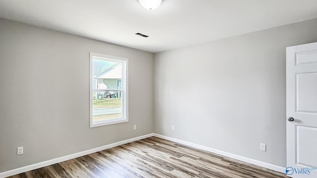 empty room featuring wood-type flooring