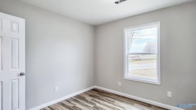 unfurnished room featuring light wood-type flooring