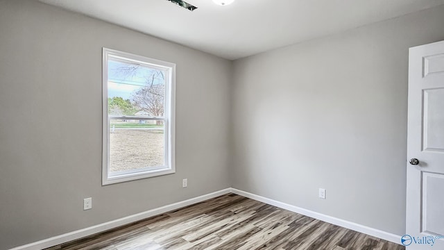 spare room with light hardwood / wood-style floors