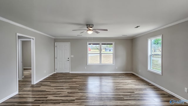 empty room featuring dark hardwood / wood-style floors, ceiling fan, and crown molding